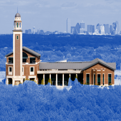 Photo of the Ryan Tower and Student Center with the City of Dallas skyline in the background.