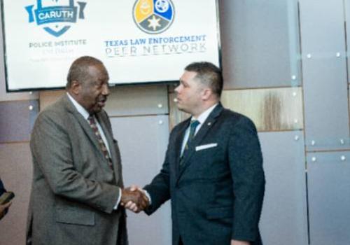 State Sen. Royce West Congratulates Dustin Schellenger at the Press Conference About TLEPN