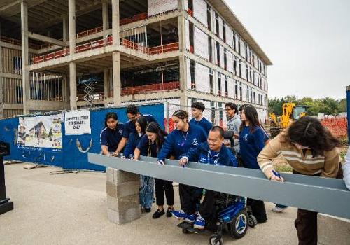 Students Sign a Steel Beam at the Topping Off Ceremony for the UNT Dallas STEM Building, Opening in Late 2025 for the Spring 2026 Semester