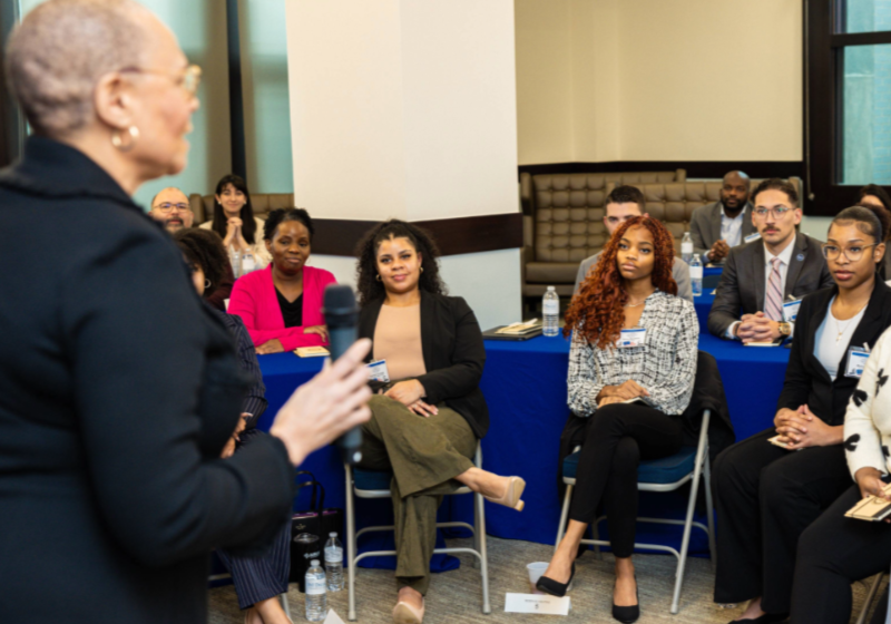 Aakira Blackmon (third from right) Listens to College of Law Dean Felicia Epps Introduce Martin Luther King III at a 2025 MLK Day Event