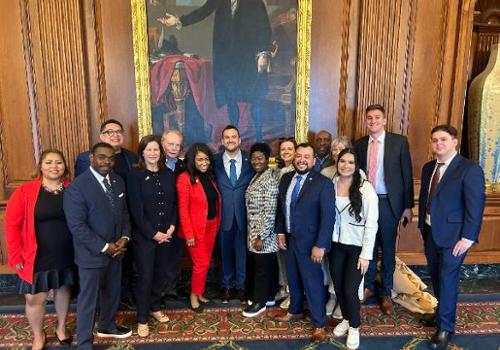 Alex Renteria (lower right) with Members of the Dallas City Council and City of Dallas Staff