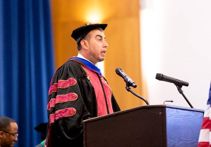 Dr. Shaqliah Speaks at a Graduate School Hooding Ceremony