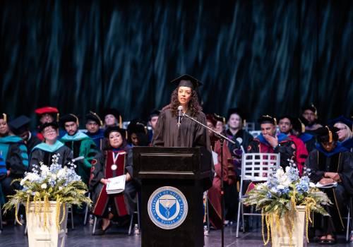 dickerson speaking on stage