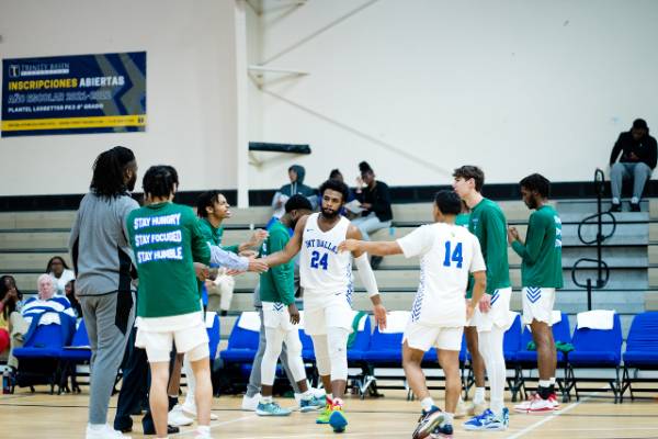 Jack Allday watching a Trailblazers basketball game from the sidelines, where he was always a fierce advocate and enthusiastic cheerleader