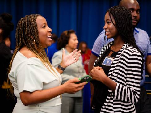 alum and student at conrad lunch