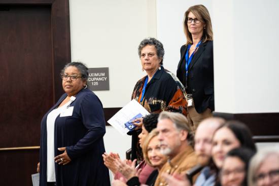 Professor Wattley watches as UNT Dallas College of Law graduates are sworn in during a courtroom ceremony.