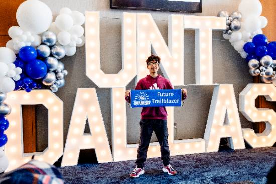 student holding "future trailblazer" sign
