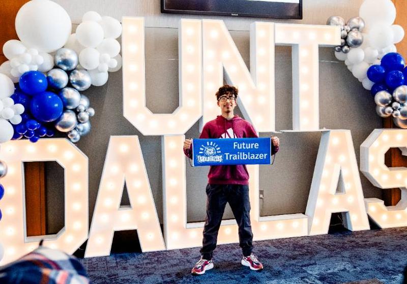 student holding "future trailblazer" sign