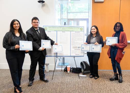 Four of the Six Students Who Researched CTABs Display Their Project Poster and Awards at the 2024 Student Research Symposium