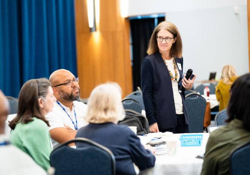 Faculty and Staff Members Listen Intently During An AI Workshop
