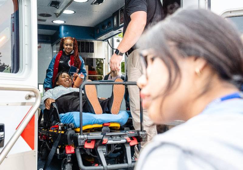 Students Explore a Care Flight Ambulance Pretending to be Patient and Paramedic