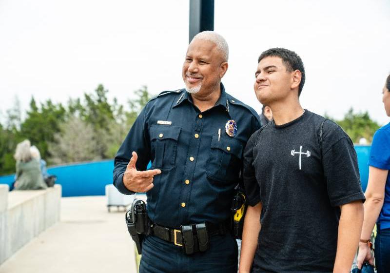 Dallas Police Chief Daniel Comeaux Poses for a Photo with a High School Student