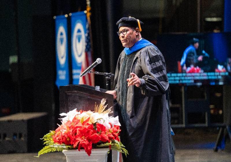 Albert C. Black Jr. Giving the Keynote Speech at the Fall 2025 Commencement with His Daughter in the Audience
