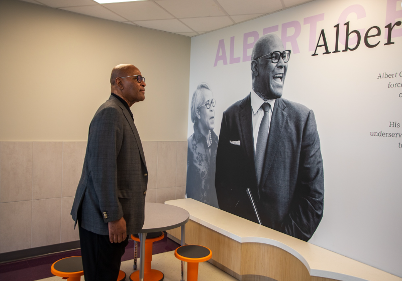 Albert C. Black Jr. Looking at a Tribute to Himself on the Wall Inside the Dallas ISD STEAM Academy in His Honor