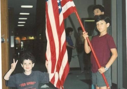Stan Borodyansky Holds an American Flag at Approximately Age 6
