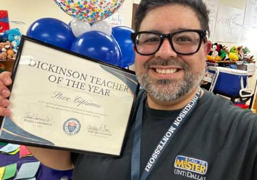 Steve Cipriano Holds the Teacher of the Year Award He Received from Dickinson Academy in Grand Prairie