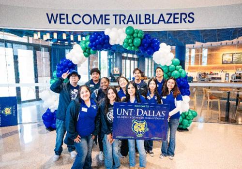 students with "welcome trailblazers" sign