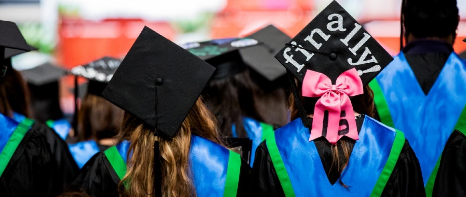 view from behind several students at UNTD graduation