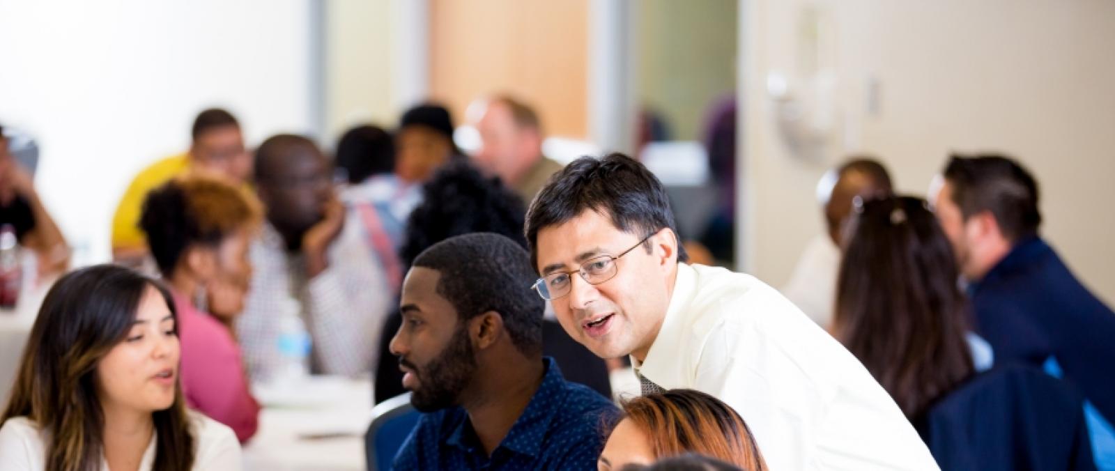 untd professor at table with students