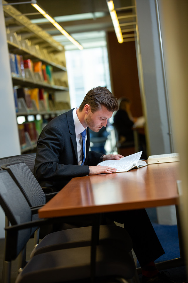 unt dallas law student reads in library