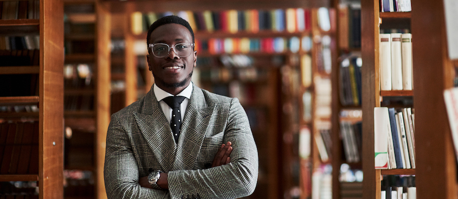 smiling black principal in library