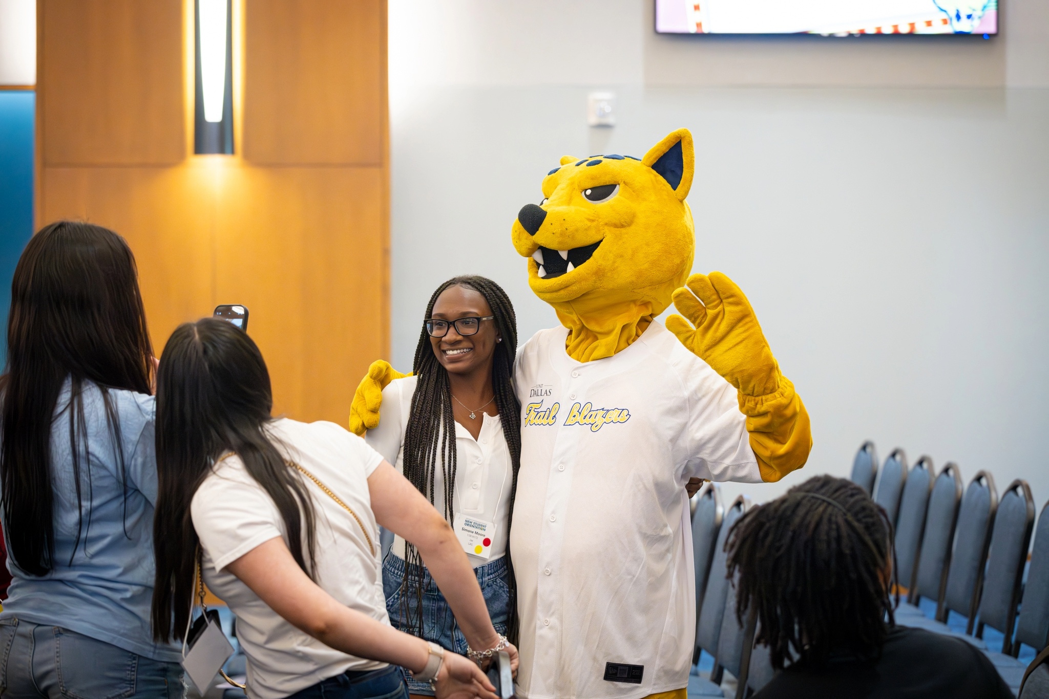 Student taking a picture with Jax