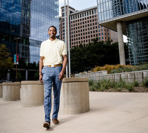 young businessman walking downtown