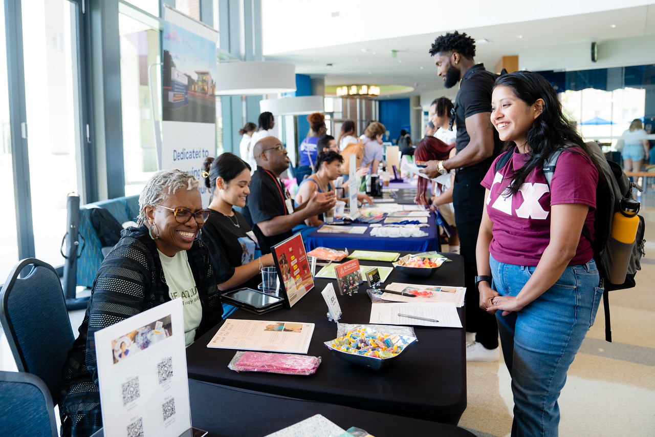 Employer talking to student at fair