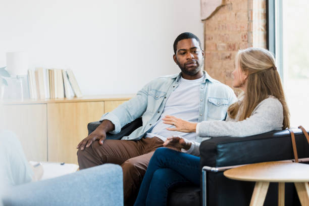 couple in conversation on couch
