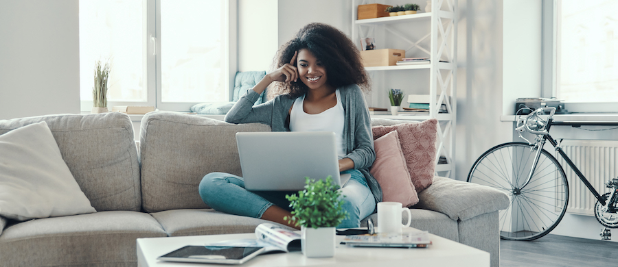 woman on couch with laptop